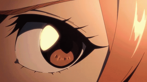 a close up of a person 's eye with a light coming out of it