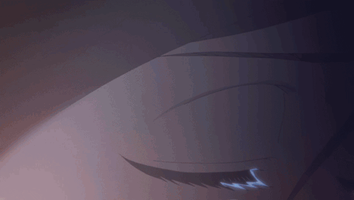 a close up of a person 's eye with a light coming out of it