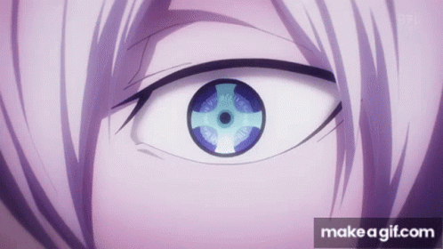 A Close Up Of A Person 'S Eye With A Purple Iris And A Blue Eye . GIF