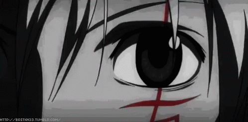 a close up of a person 's eye with a red cross on it ..