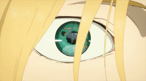 A Close Up Of A Person 'S Eye With A Reflection Of A Man In It GIF