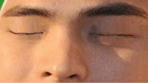 a close up of a person 's eye with their eyes closed