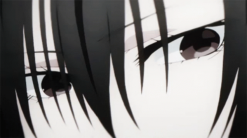 A Close Up Of A Person 'S Eyes With A Black Hair GIF