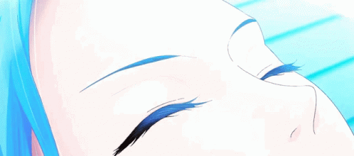 A Close Up Of A Person 'S Eyes With A Blue Iris GIF