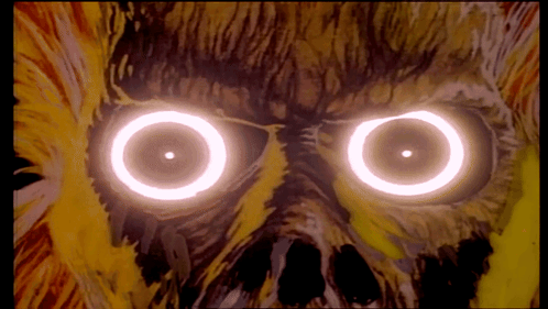 A Close Up Of A Person 'S Eyes With Glowing Circles Around Them GIF