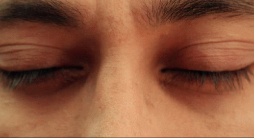 A Close Up Of A Person 'S Eyes With Their Eyelashes Closed GIF