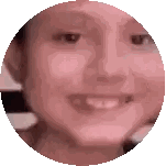 a close up of a person 's face in a circle with a smile on it .