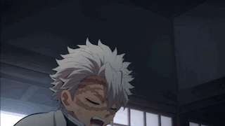 A Close Up Of A Person 'S Face In A Dark Room GIF