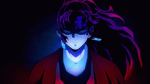 A Close Up Of A Person 'S Face In A Dark Room With Purple Hair And Earrings . GIF