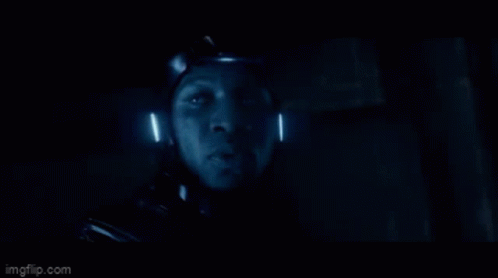 A Close Up Of A Person 'S Face In A Dark Room With The Words Imgflip.com At The Bottom GIF