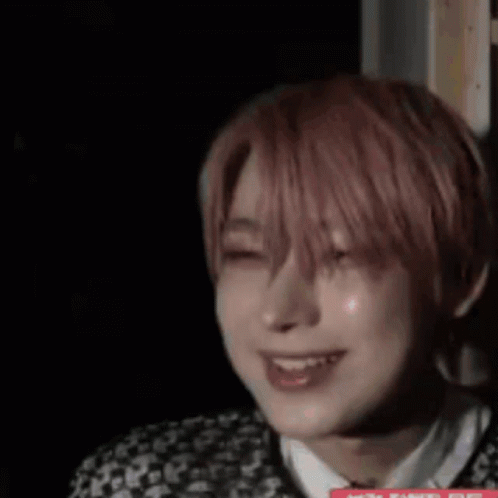 A Close Up Of A Person 'S Face In A Dark Room . GIF