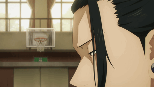 A Close Up Of A Person 'S Face In Front Of A Basketball Hoop GIF