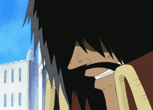 A Close Up Of A Person 'S Face In Front Of A White Building GIF