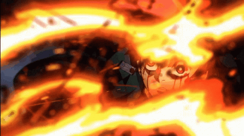 A Close Up Of A Person 'S Face Surrounded By Fire . GIF