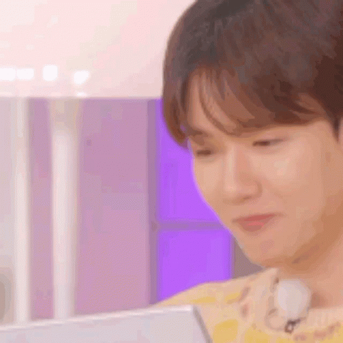 A Close Up Of A Person 'S Face While Using A Tablet Computer . GIF