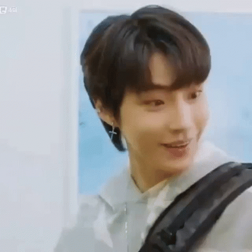 A Close Up Of A Person 'S Face With A Backpack . GIF