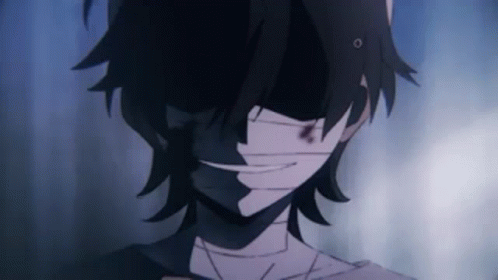 A Close Up Of A Person 'S Face With A Bandage Around His Mouth . GIF