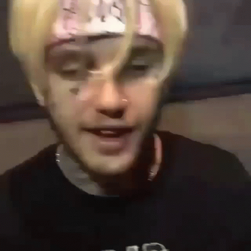 A Close Up Of A Person 'S Face With A Bandana On It . GIF