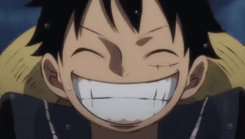 a close up of a person 's face with a big smile on it