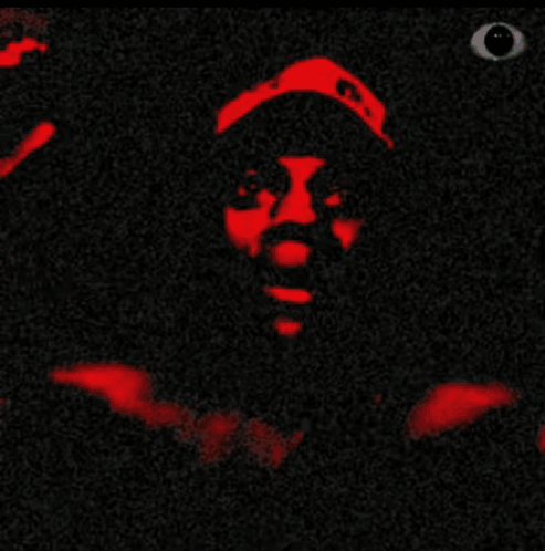A Close Up Of A Person 'S Face With A Black Background And Red Lips GIF