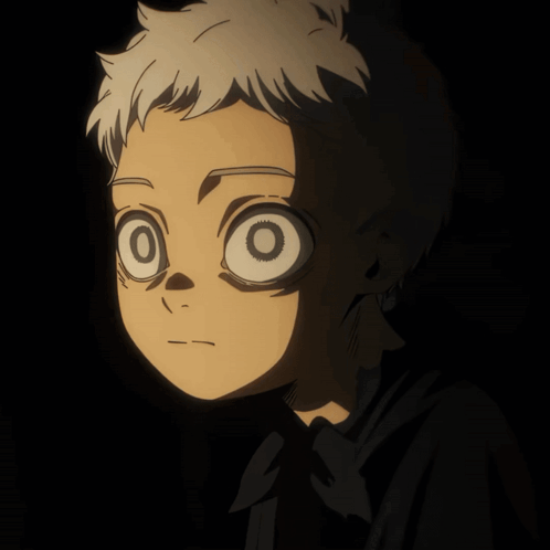 A Close Up Of A Person 'S Face With A Black Background GIF