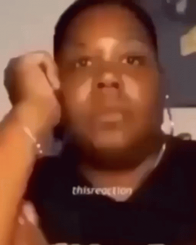 A Close Up Of A Person 'S Face With A Black Shirt On . GIF