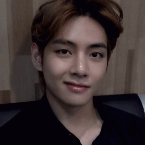 A Close Up Of A Person 'S Face With A Black Shirt On . GIF