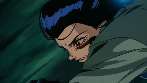 A Close Up Of A Person 'S Face With A Blue Hair GIF