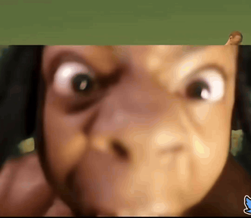 A Close Up Of A Person 'S Face With A Blue S On The Bottom GIF
