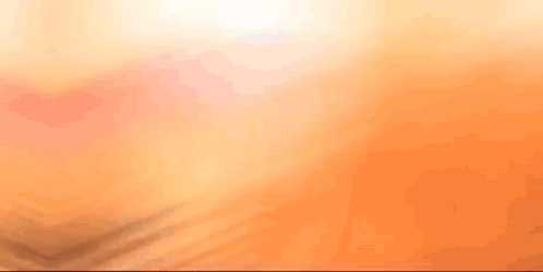 A Close Up Of A Person 'S Face With A Blurred Background GIF