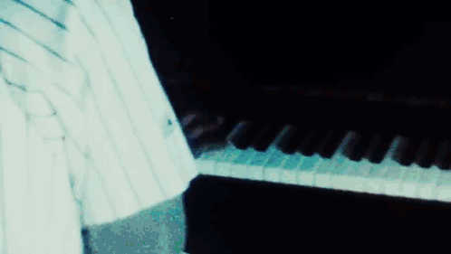 A Close Up Of A Person 'S Face With A Blurred Background . GIF