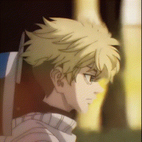 A Close Up Of A Person 'S Face With A Blurry Background And A Yellow Haired Anime Character . GIF