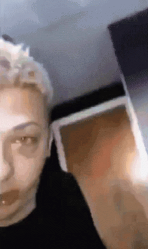 A Close Up Of A Person 'S Face With A Blurry Background GIF