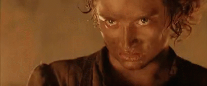 A Close Up Of A Person 'S Face With A Brown Shirt On GIF