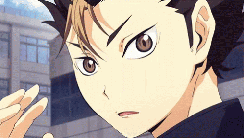 A Close Up Of A Person 'S Face With A Building In The Background GIF