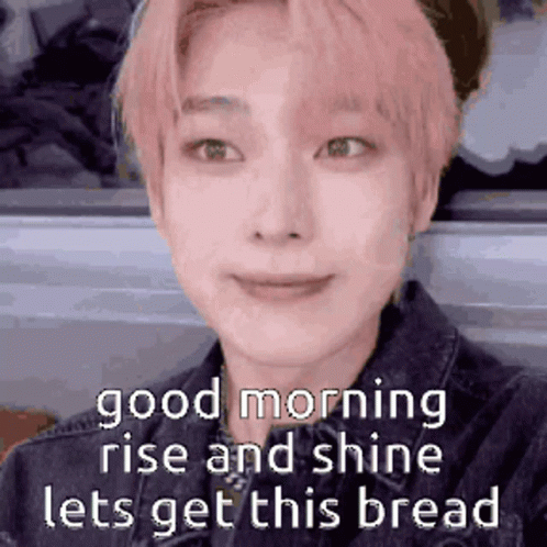 A Close Up Of A Person 'S Face With A Caption That Says `` Good Morning Rise And Shine Lets Get This Bread '' . GIF