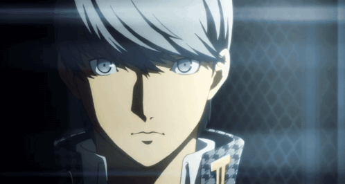 A Close Up Of A Person 'S Face With A Checkered Jacket On GIF