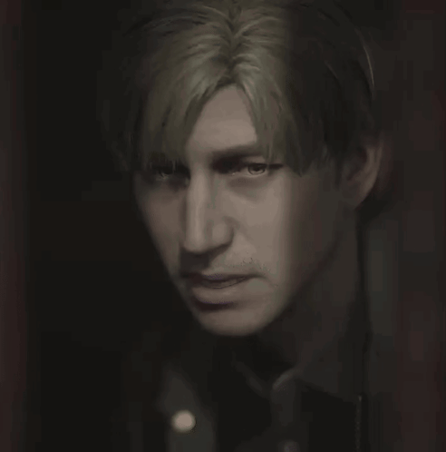 A Close Up Of A Person 'S Face With A Dark Background GIF