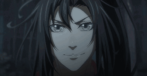 A Close Up Of A Person 'S Face With A Dark Background GIF