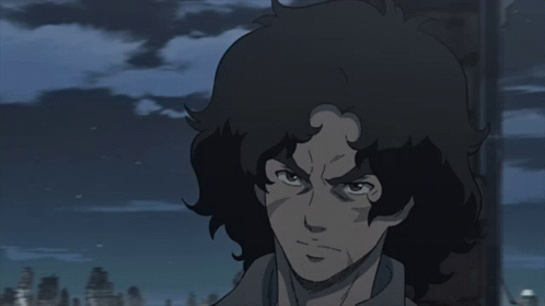 A Close Up Of A Person 'S Face With A Dark Background GIF