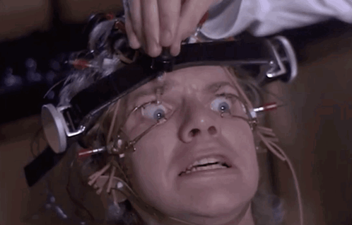 A Close Up Of A Person 'S Face With A Device On Their Head GIF