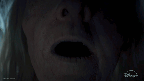 A Close Up Of A Person 'S Face With A Disney Logo GIF