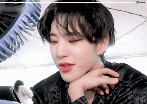 A Close Up Of A Person 'S Face With A Fan In The Background And The Word Preference On The Bottom GIF