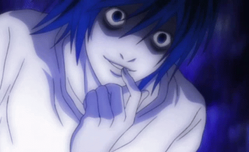 A Close Up Of A Person 'S Face With A Finger In Their Mouth GIF