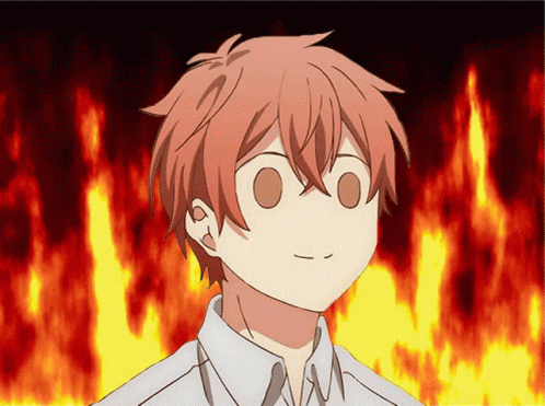 A Close Up Of A Person 'S Face With A Fire Background GIF