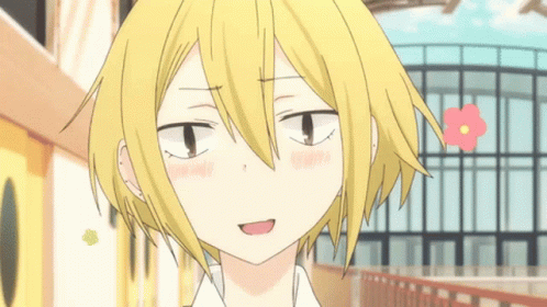 A Close Up Of A Person 'S Face With A Flower In The Background GIF