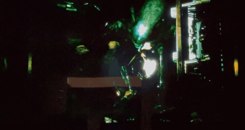 A Close Up Of A Person 'S Face With A Glowing Mouth GIF