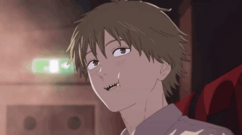 A Close Up Of A Person 'S Face With A Green Light Behind Them GIF