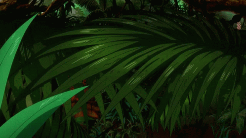 A Close Up Of A Person 'S Face With A Green Plant In The Background GIF