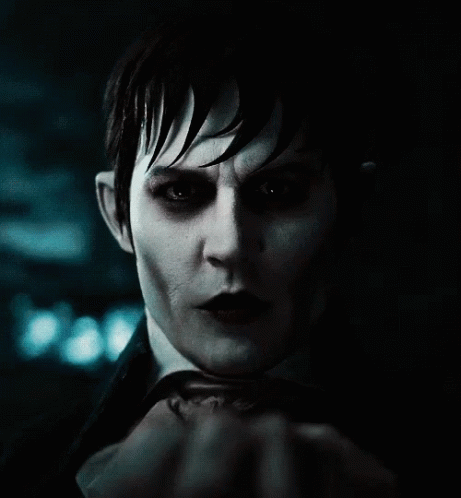 A Close Up Of A Person 'S Face With A Hand Covering It GIF